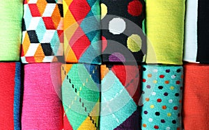 Different colorful socks as background,