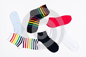 Different colorful textile type of socks on white background. Clothes for legs. Casual style. Top view