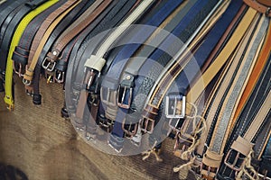 Different colors leather belt on display at the market