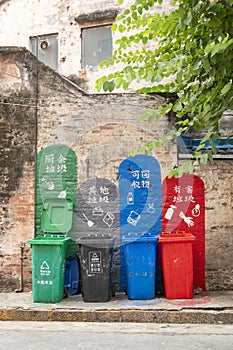 different colors litter bins for garbage sorting at vertical composition