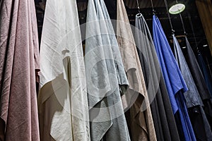 different colors of textile fabrics in an atelier or a fabric store