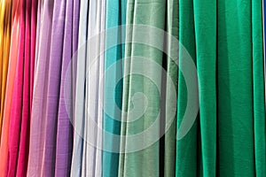 different colors of textile fabrics in an atelier or a fabric store