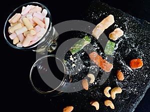 Different coloured marshmellows in glass