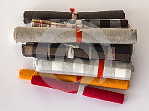 Different colours rolls of linen cloth