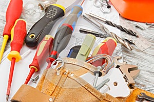 Different construction tools, wooden background