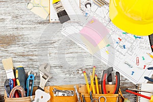 Different construction tools, wooden background