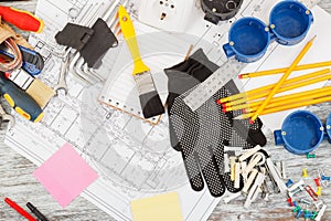 Different construction tools, wooden background