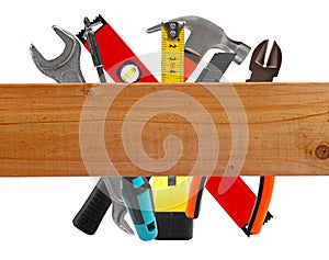 Different construction tools and wooden plank