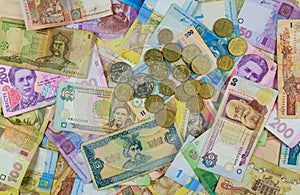 Different currency bills creating a colorful background