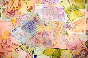 Different currency note and coins from different countries background