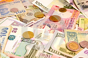 Different currency note and coins from different countries background