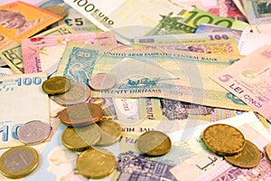 Different currency note and coins from different countries background