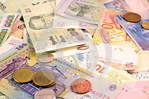 Different currency note and coins from different countries background