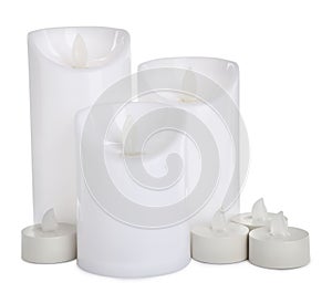Different decorative flameless LED candles on white