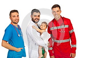 Different doctors holding baby