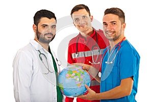 Different doctors with world globe