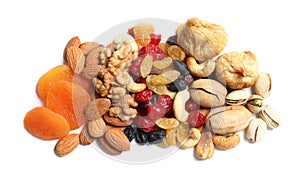 Different dried fruits and nuts on white background