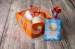 Different Easter eggs table decoration with postcard