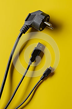 Different electric plug connector on yellow background