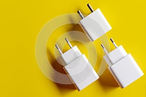 Different electric plug connector on yellow background