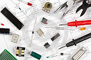 Different electronic parts or components on pcb wiring scheme with resistors, capacitors, diode and ic chips, flat lay top view