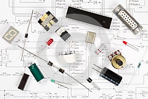 Different electronic parts or components on pcb wiring scheme with resistors, capacitors, diode and ic chips, flat lay top view