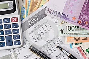 Different euro bills with 2017 calendar