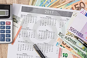 Different euro bills with 2017 calendar