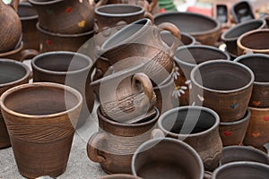 Different examples of traditional ukrainian clay pottery: pots, jars, vases, cups and bowls