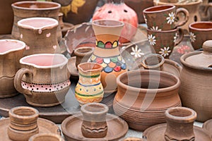 Different examples of traditional ukrainian clay pottery: pots, jars, vases, cups and bowls