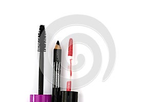 Different female cosmetics on white: mascara, eyeliner and lip gloss.