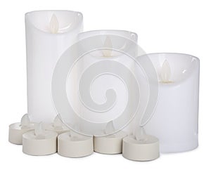 Different flameless LED candles on white