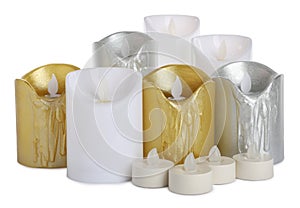 Different flameless LED candles on white background