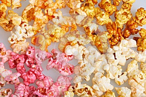 Different flavors of popcorn cherry, caramel, salted, cheese tastes