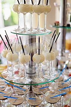 Different fresh alcoholic cocktail in glass on bar table, many colorful drinks.