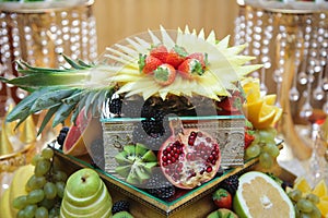 Different fresh fruits on wedding buffet table. Wedding table decoration. Buffet reception fruits