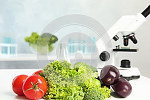 Different fresh vegetables on table in laboratory, space for text. Poison detection