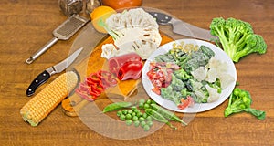 Various frozen and fresh vegetables on a cooking table