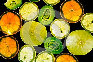 Different fruit slices in backlight