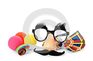 Different funny clown`s accessories on white background