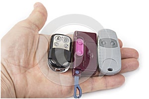 Different garage wireless remote controls for opening and closing.