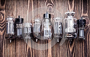 Different generations of electronic vacuum tubes. closeup view.