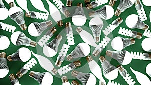 different glowing Lighting Bulbs set 3d render on green background