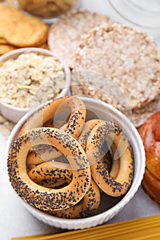 Different gluten free products on light grey table, above view