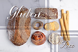 Different gluten free products on white marble table, flat lay