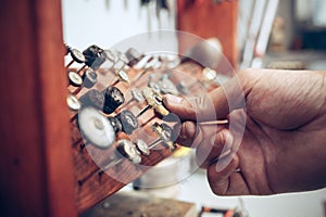 Different goldsmiths tools on the jewelry workplace. Jeweler at work in jewelry.