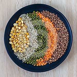 Different grains in the bowl: rice, moong beans, dal and buckwheat