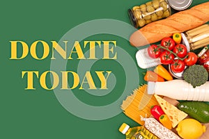 Different groceries, food donations on green background with copyspace - pasta, fresh vegatables, canned food, baguette, cooking