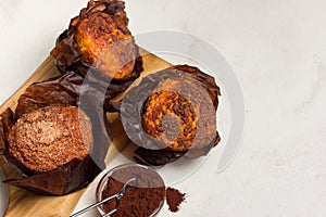 Different homemade muffins with chocolate and cacao and baking. Copyspace