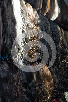 Different human hair extensions in wig shop